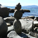 blog logo of a pile of stones on a beach